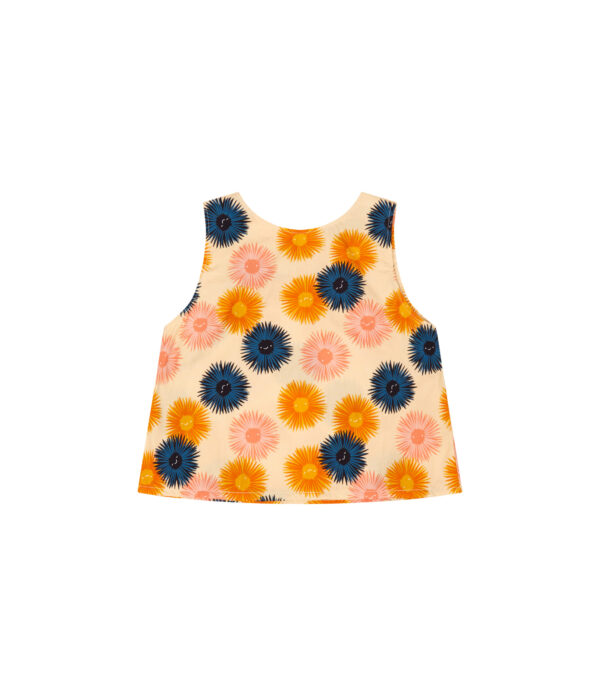 Lana sea urchin top is made in organic cotton for girls. Its background is light yellow with orange, blue and pink sea urchin smiley faces.