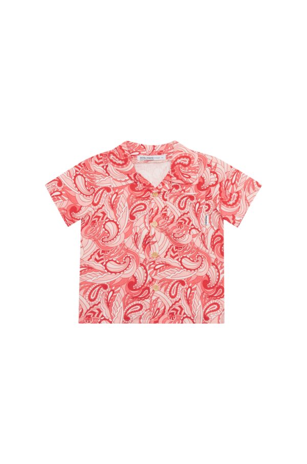 A kid's linen short sleeve shirt with red, pink and white paisley design.
