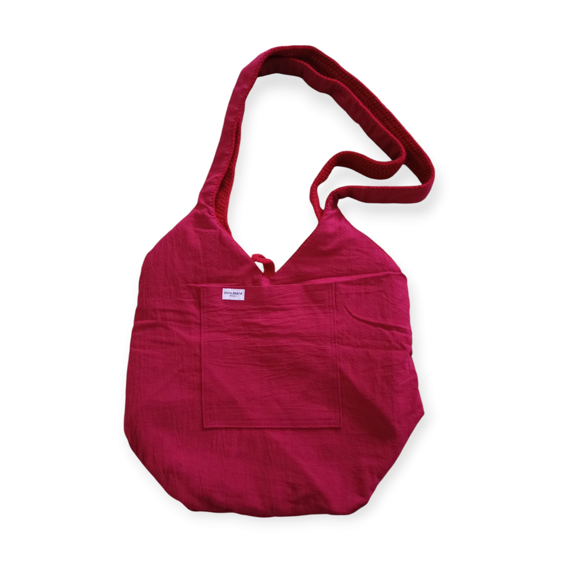 The inside of Cherry Crochet Bag, showing cotton lining and large internal pocket