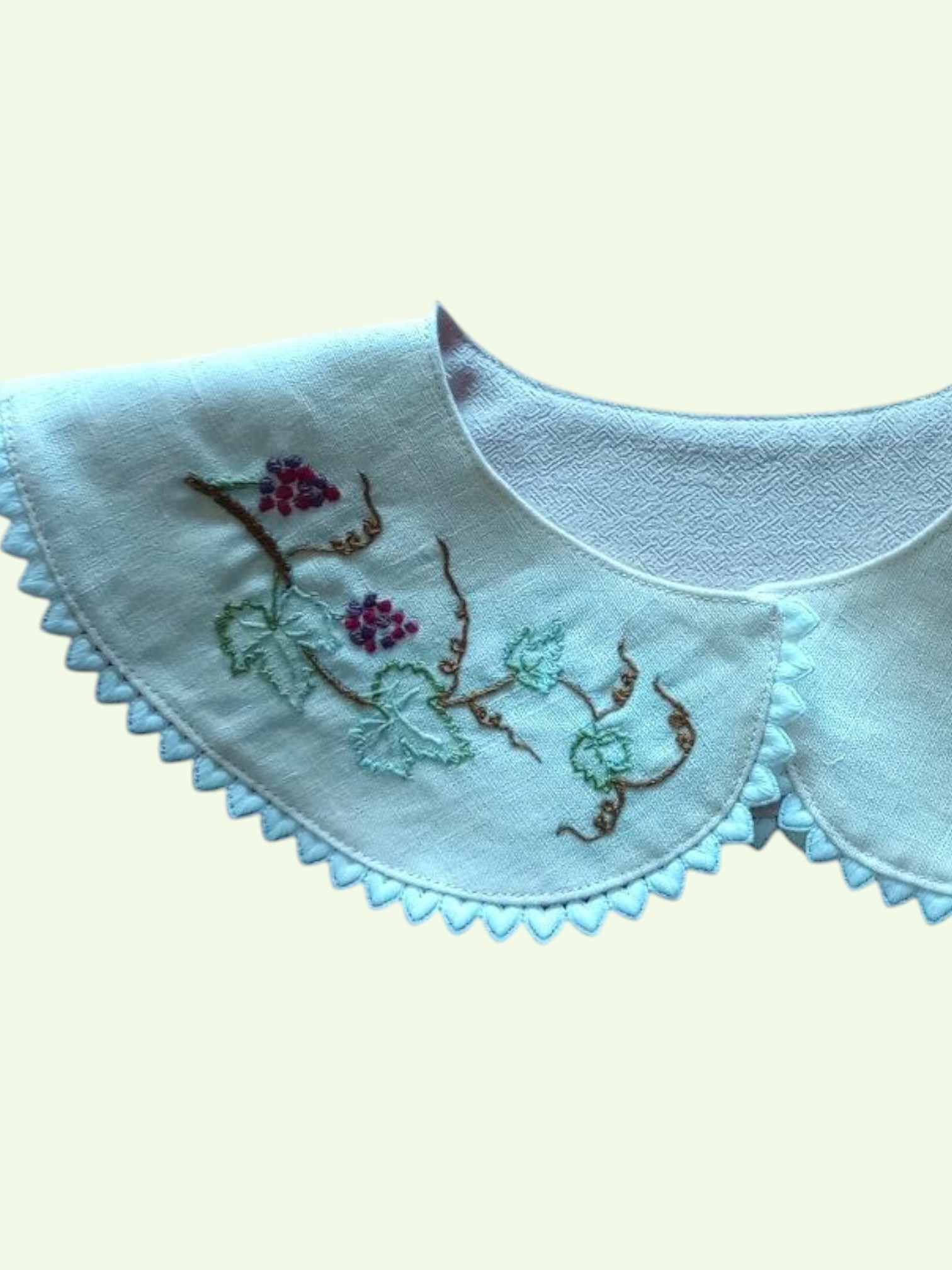 Close up detail of embroidery on a Ladies detachable linen collar.
