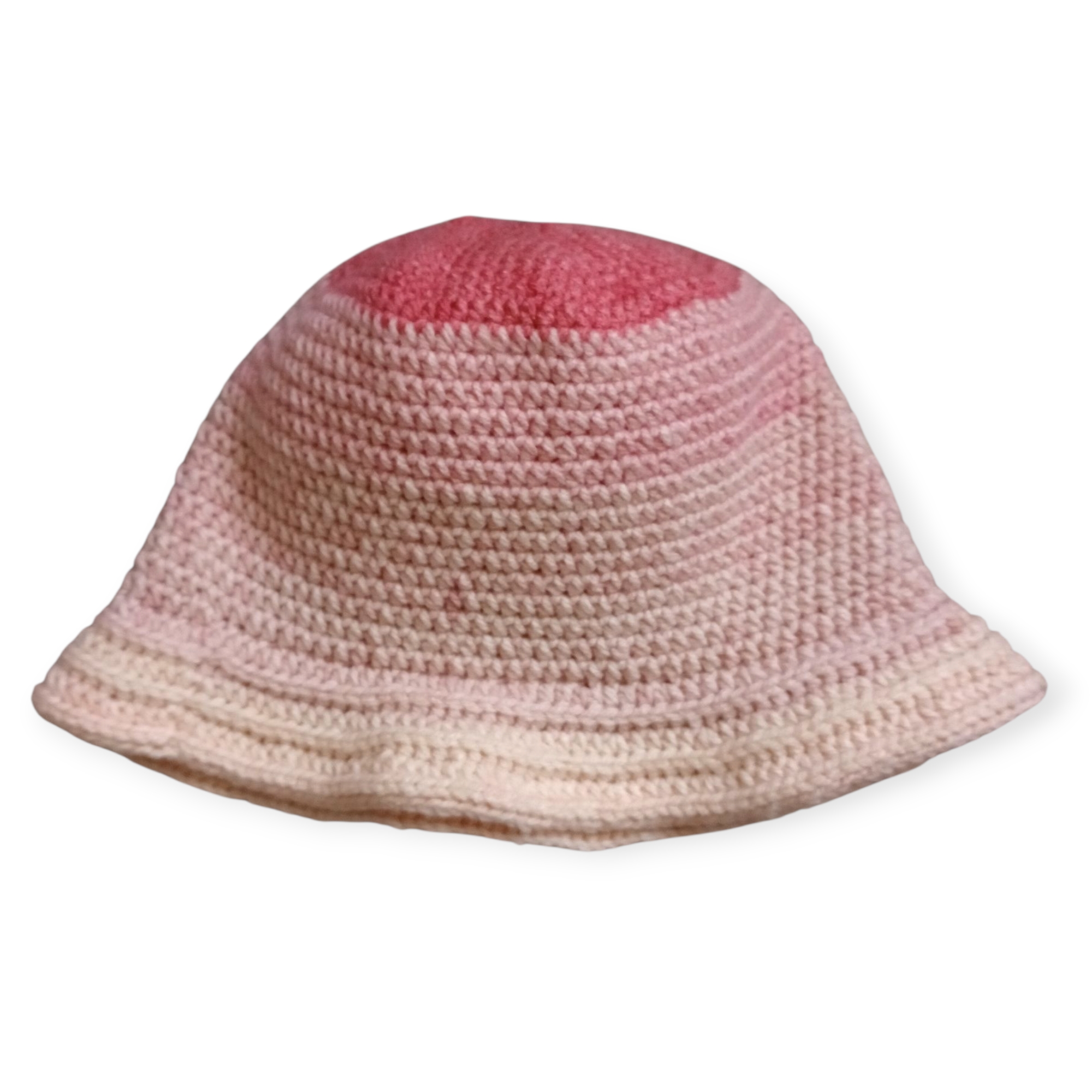 Handmade crochet bucket hat in pink ombre gradient, laying flat to show stitch texture