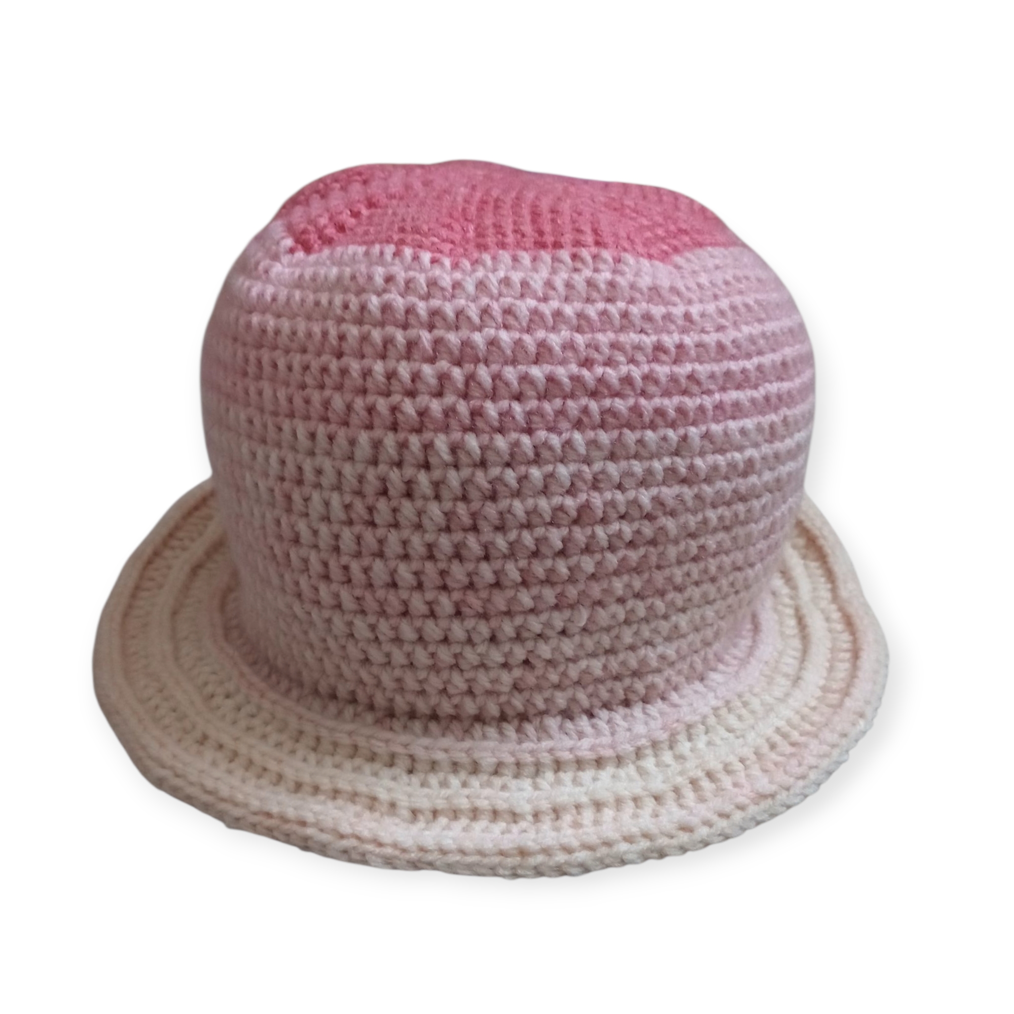 Front view of handmade crochet bucket hat in pink ombre gradient with textured stitch detail