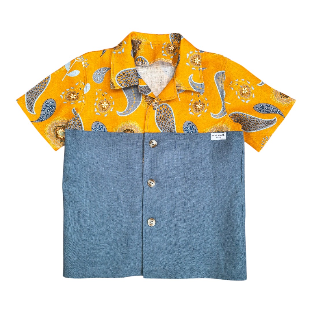 boys linen shirt orange paisley is made from blue-grey linen for the lower part and the rest of the shirt uses Miramara original print. Two secret chest pockets where fabrics overlap.