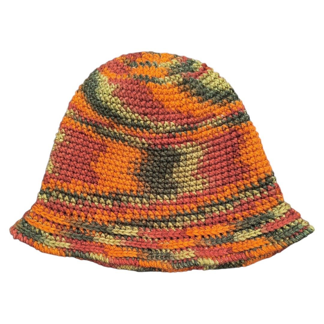 Hand crocheted bucket hat in multicolored autumn tones with tight stitches and a slightly flared brim.