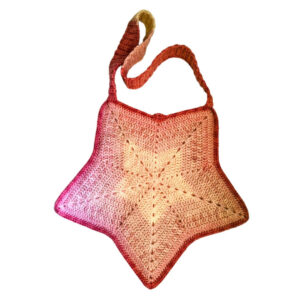 Handmade five‑point star crochet bag in a beige‑to‑pink gradient, made from a 30% wool and 70% acrylic yarn blend.